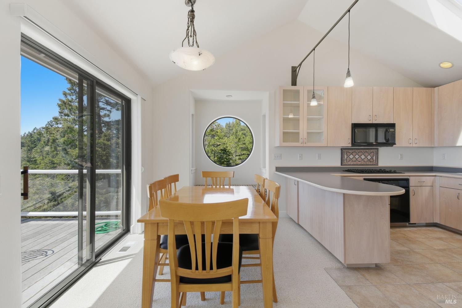 45340 Sequoia Road Gualala, CA 95445 - Photo 13 of 63 Dining/kitchen opens up to view deck.