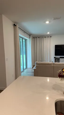 a kitchen with sink cabinets and stainless steel appliances