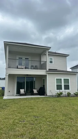 a view of a house with a yard and plants