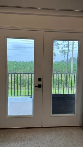 a bedroom with windows