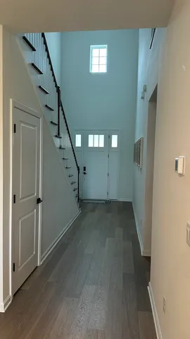 a view of a hallway view with staircase