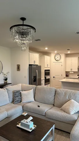 a kitchen with stainless steel appliances a stove a sink and a refrigerator
