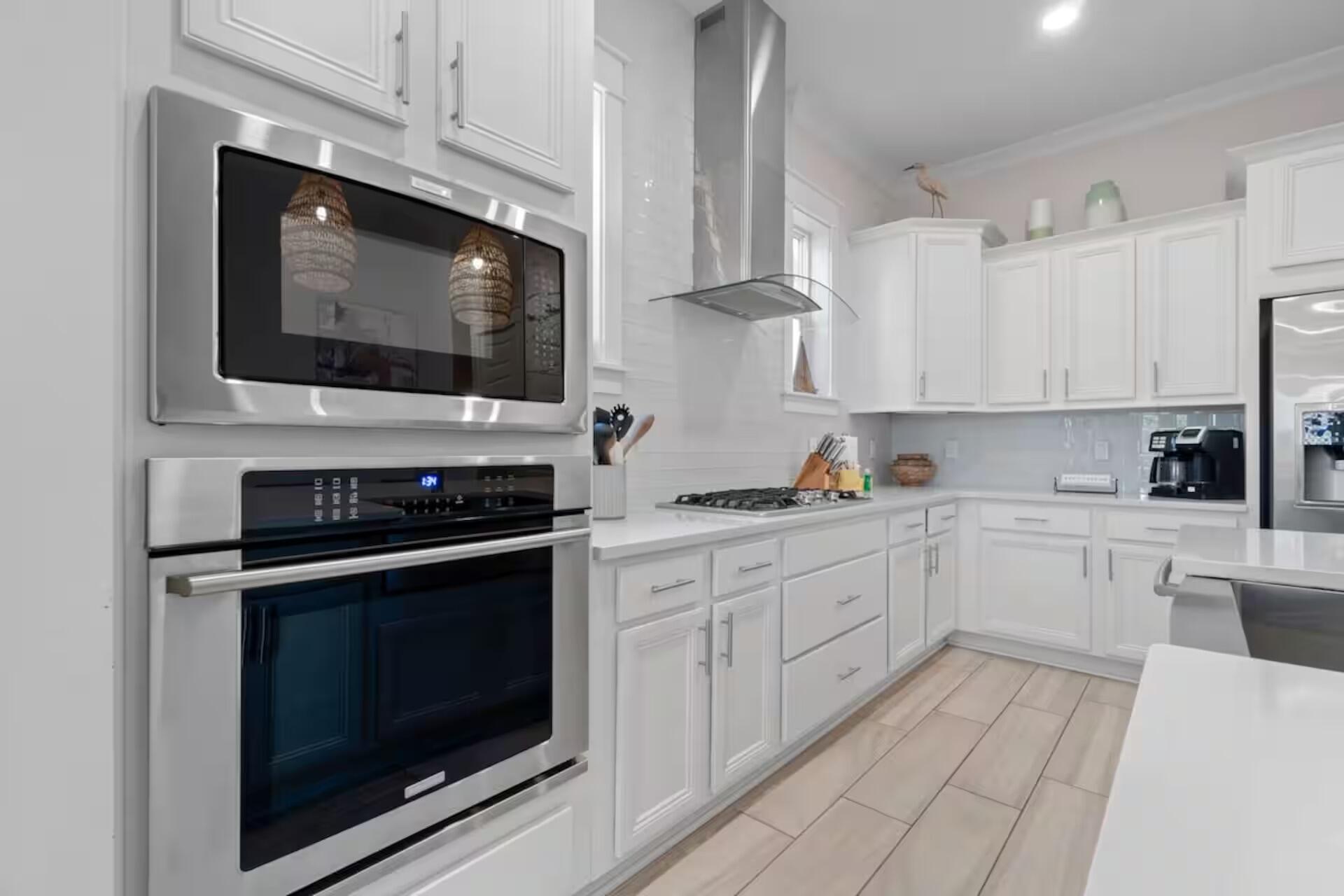 146 East E Pine, Unit B Inlet Beach, FL 32461 - Photo 12 of 47 a kitchen with stainless steel appliances granite countertop a stove microwave and cabinets