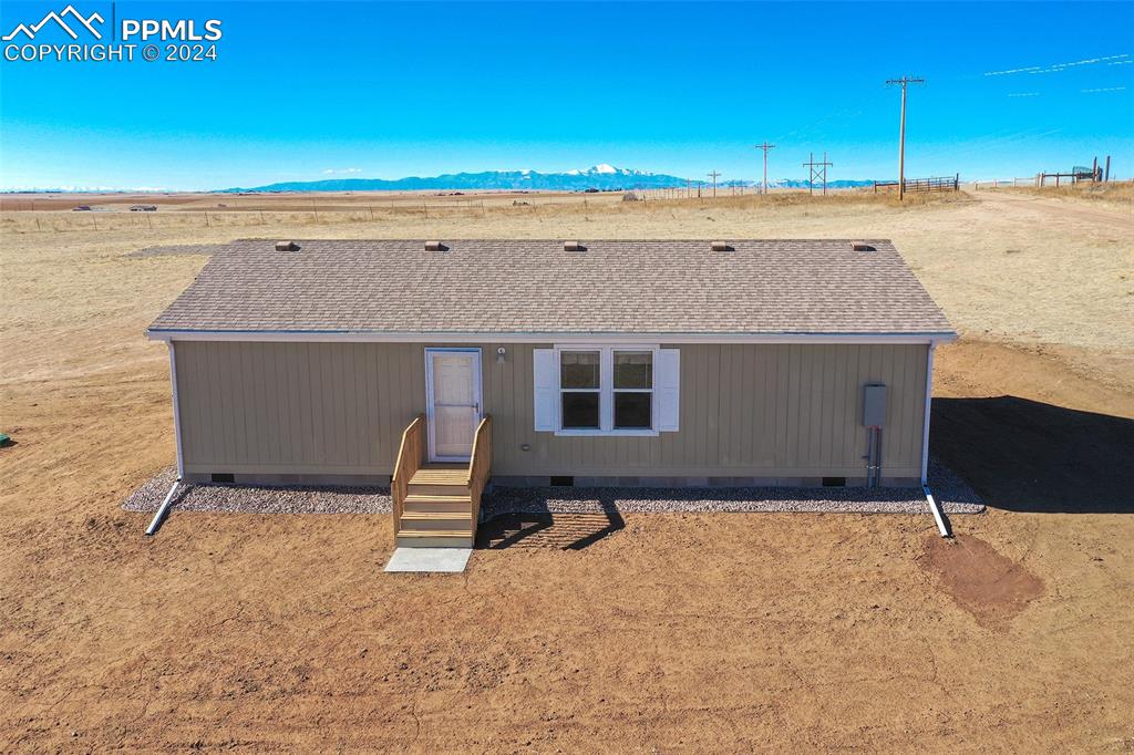 33355 Berndt Road Yoder, CO 80864 - Photo 3 of 26 a front view of a house with a yard
