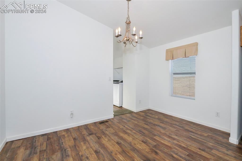 33355 Berndt Road Yoder, CO 80864 - Photo 6 of 26 wooden floor in an empty room