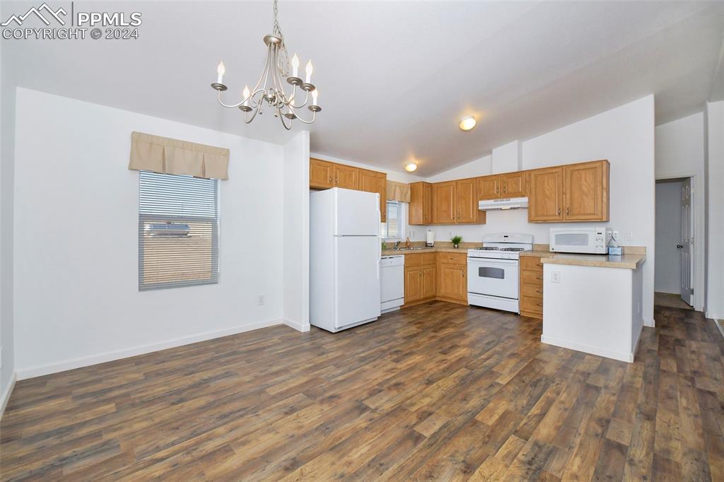 33355 Berndt Road Yoder, CO 80864 - Photo 9 of 26 a view of a kitchen with wooden floor