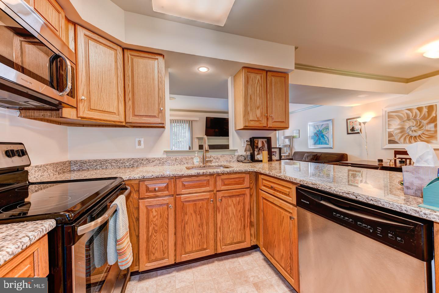 24 Trafalgar Road, Unit 233 Doylestown, PA 18901 - Photo 9 of 23 Kitchen with granite and stainless steel