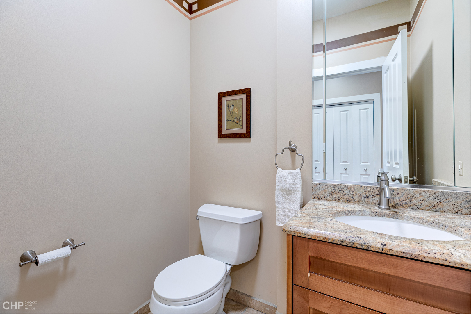275 Lawton Road Riverside, IL 60546 - Photo 16 of 35 a bathroom with a granite countertop toilet sink and mirror