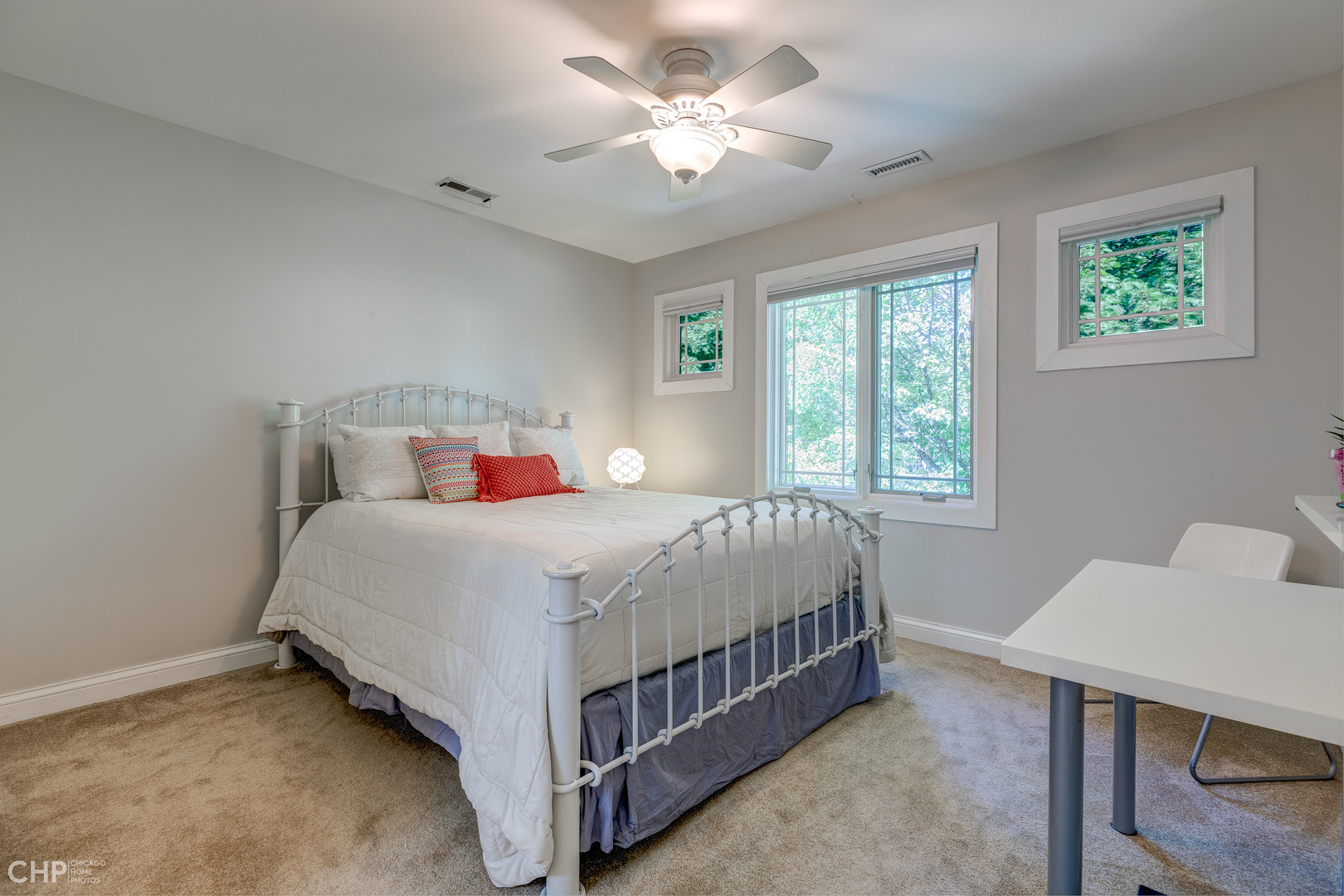 275 Lawton Road Riverside, IL 60546 - Photo 20 of 35 a bedroom with a bed and a table in it with window