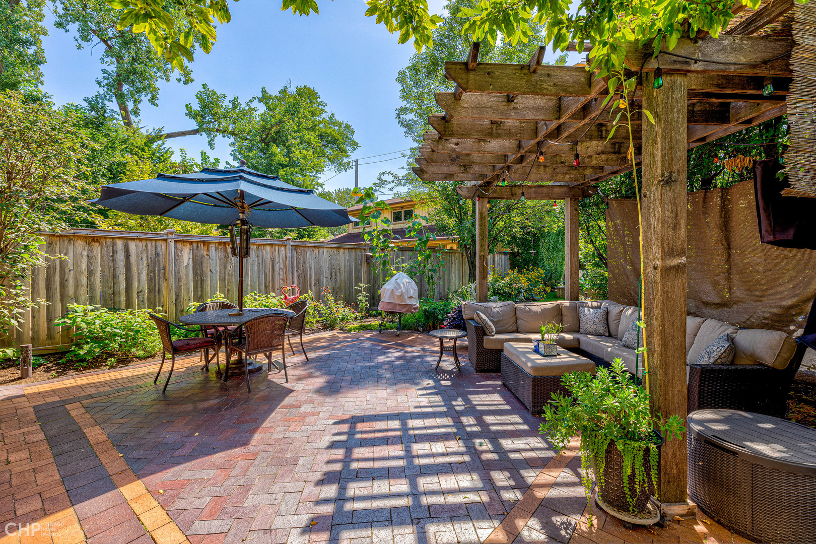 275 Lawton Road Riverside, IL 60546 - Photo 30 of 35 a view of a patio with a table chairs and a potted plant