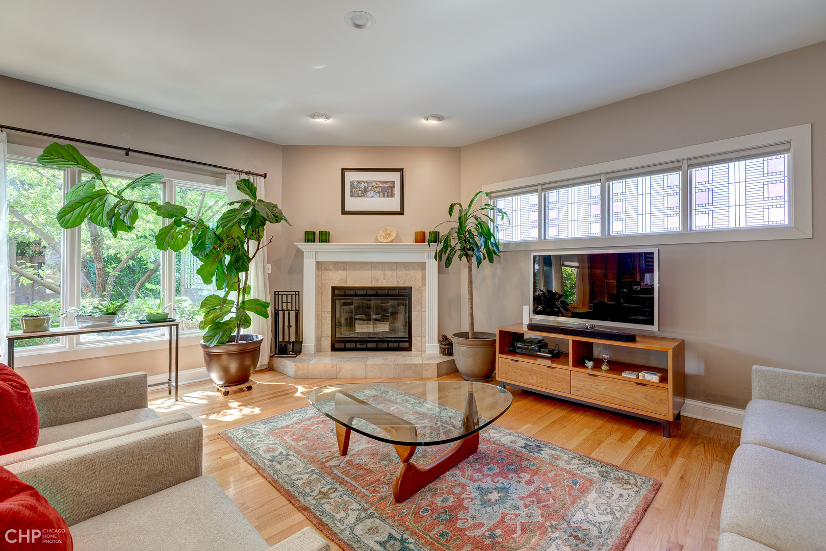 275 Lawton Road Riverside, IL 60546 - Photo 9 of 35 a living room with furniture a flat screen tv and a fireplace