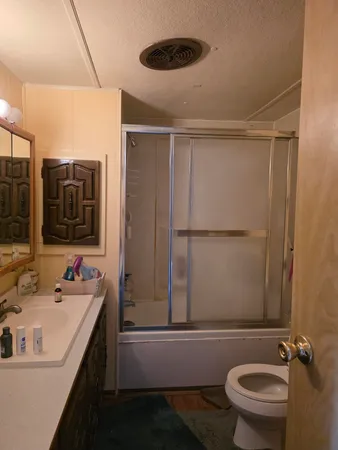 a view of walk in closet with clothes