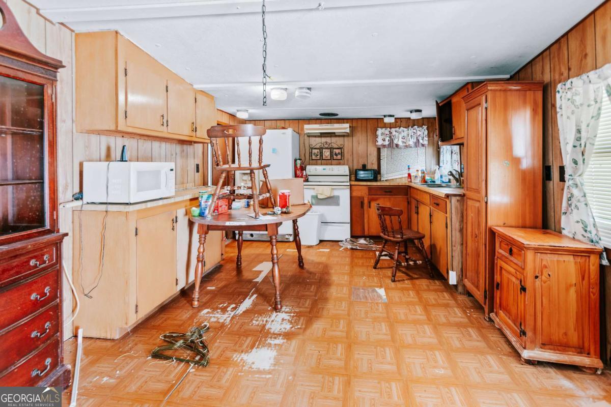 139 Wesley Chapel Road Lexington, GA 30648 - Photo 17 of 23 a view of a dining room with furniture window and outside view