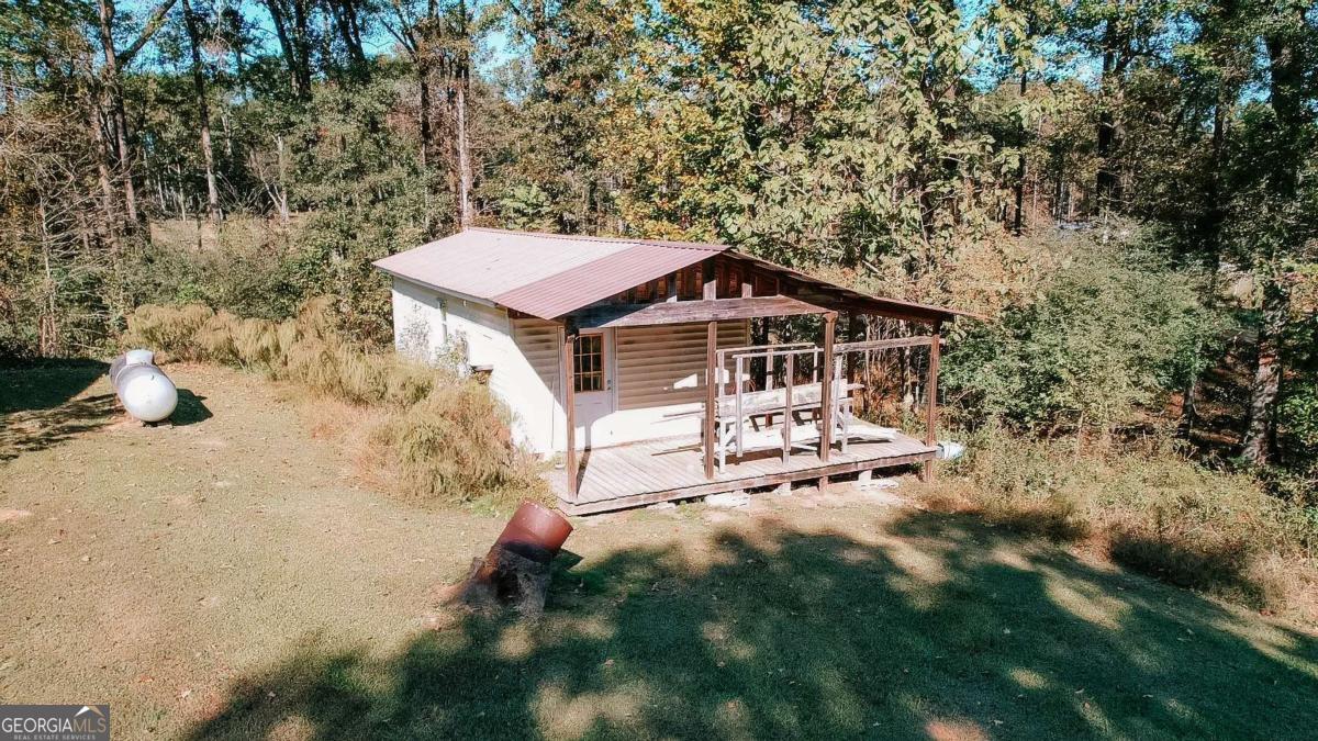 139 Wesley Chapel Road Lexington, GA 30648 - Photo 18 of 23 a house with trees in front of it
