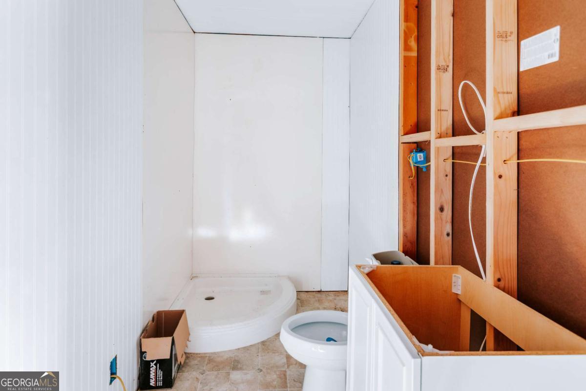 139 Wesley Chapel Road Lexington, GA 30648 - Photo 19 of 23 a bathroom with a sink toilet and shower
