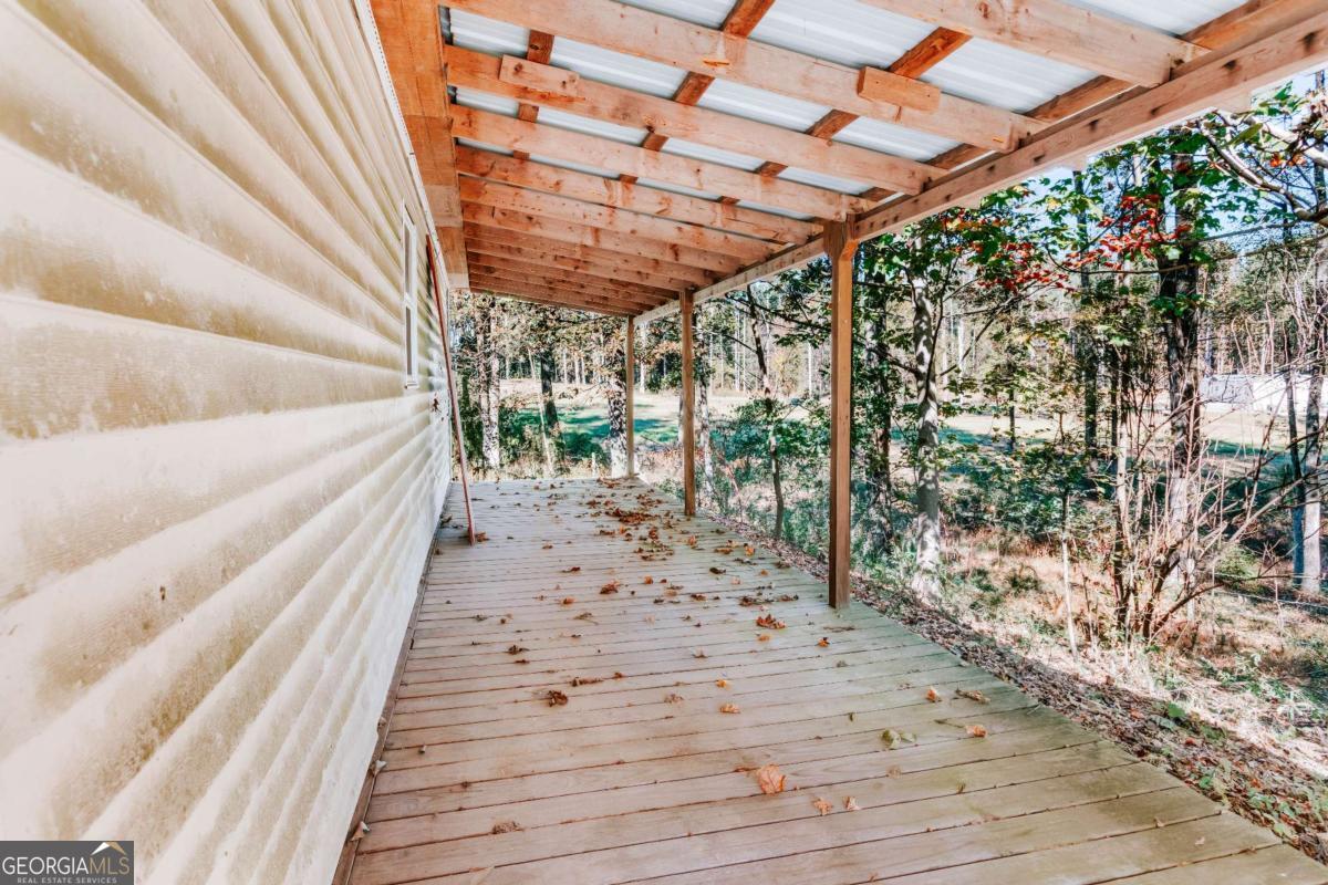 139 Wesley Chapel Road Lexington, GA 30648 - Photo 20 of 23 a view of a backyard with pathway