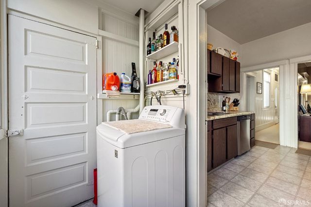 a kitchen with a refrigerator and a sink