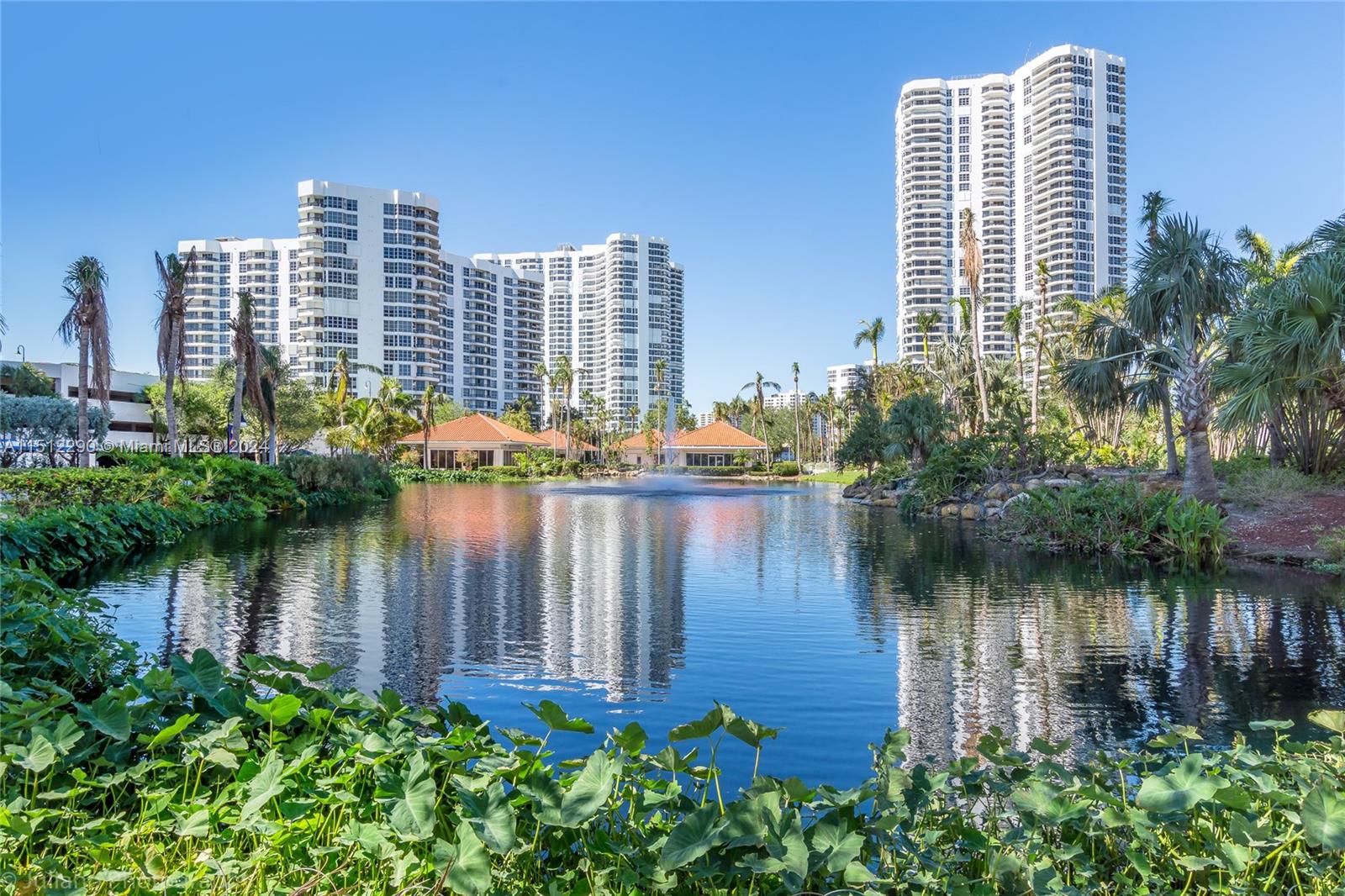a lake view with tall buildings and a lake view