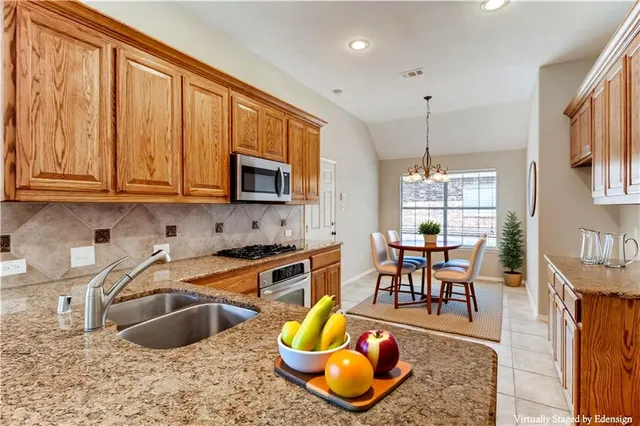 a bedroom with a bed and a potted plant
