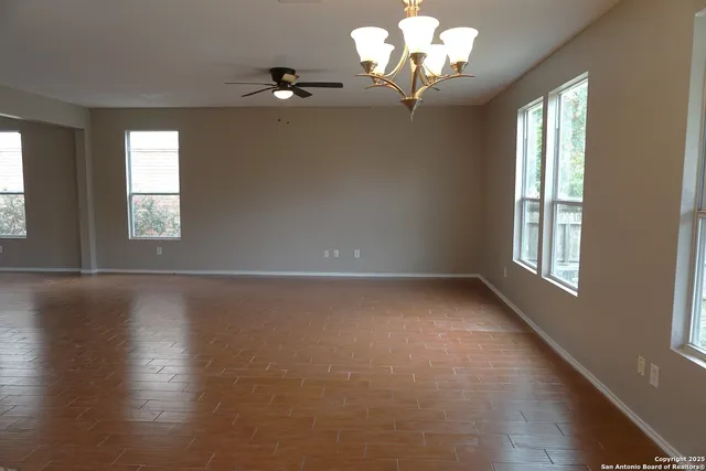 a view of room with window and hardwood floor