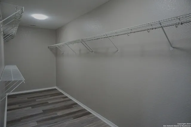 a view of a room with racks on the wall