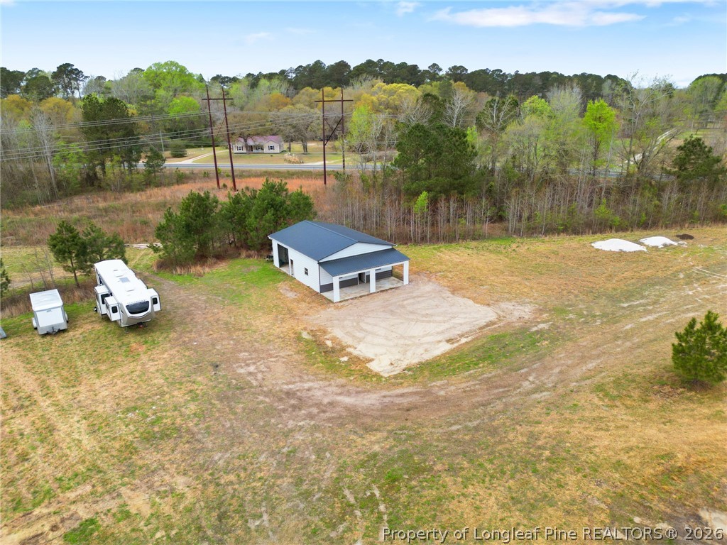 5535 Butler Nursery Road Fayetteville, NC 28306 - Photo 50 of 50 a view of a backyard with a garden and mountain view