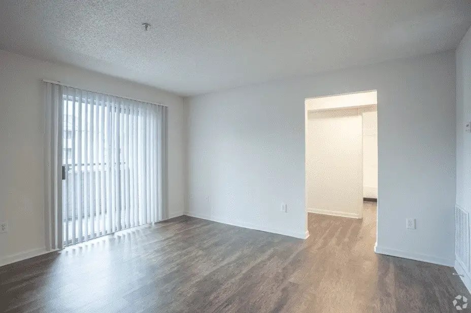 100 Marshview Drive Newport News, VA 23608 - Photo 7 of 15 an empty room with wooden floor and windows