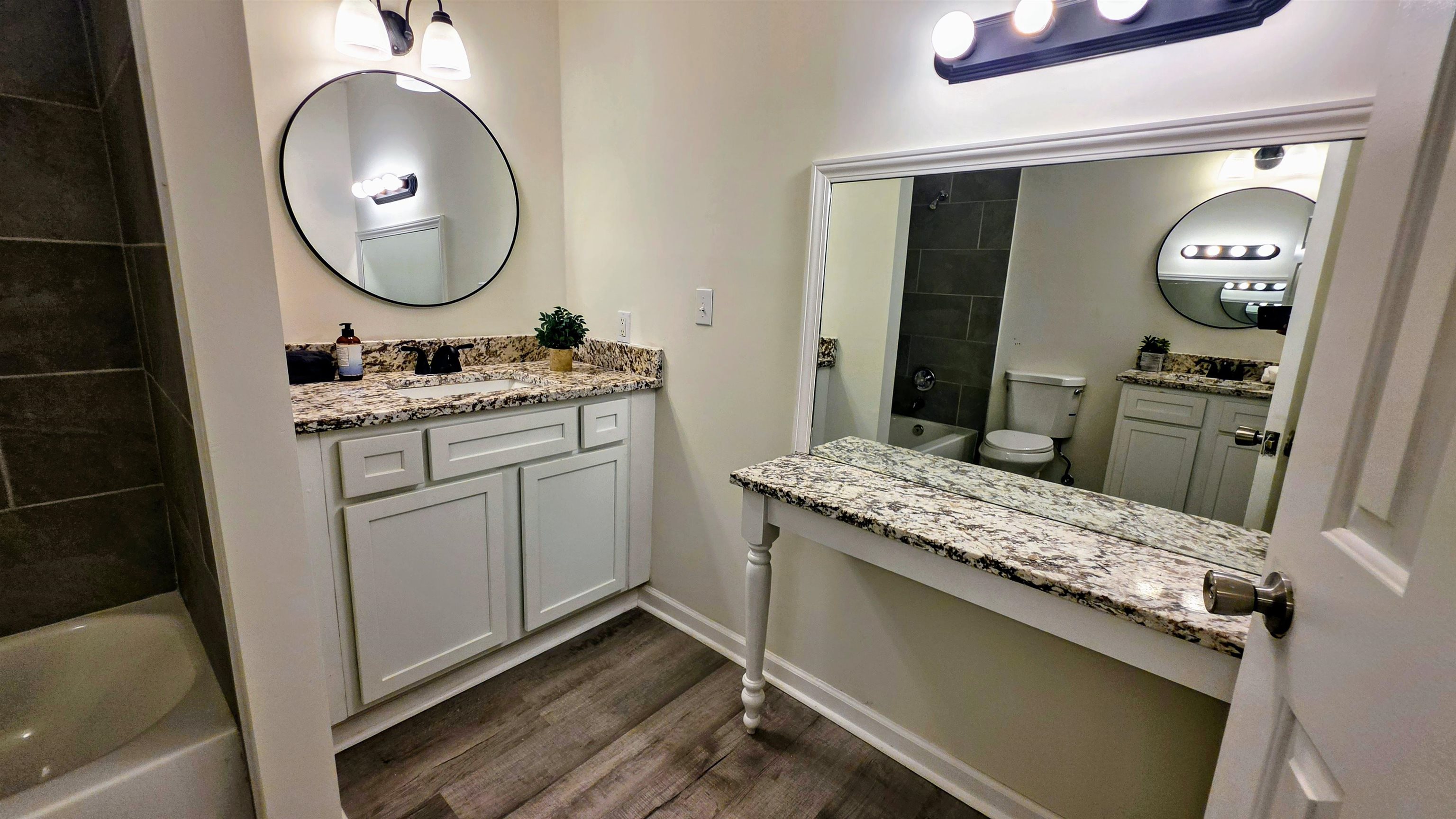 4264 Timber Rise Road Memphis, TN 38125 - Photo 15 of 32 Full bathroom featuring vanity, bathtub / shower combination, and dark wood-style floors