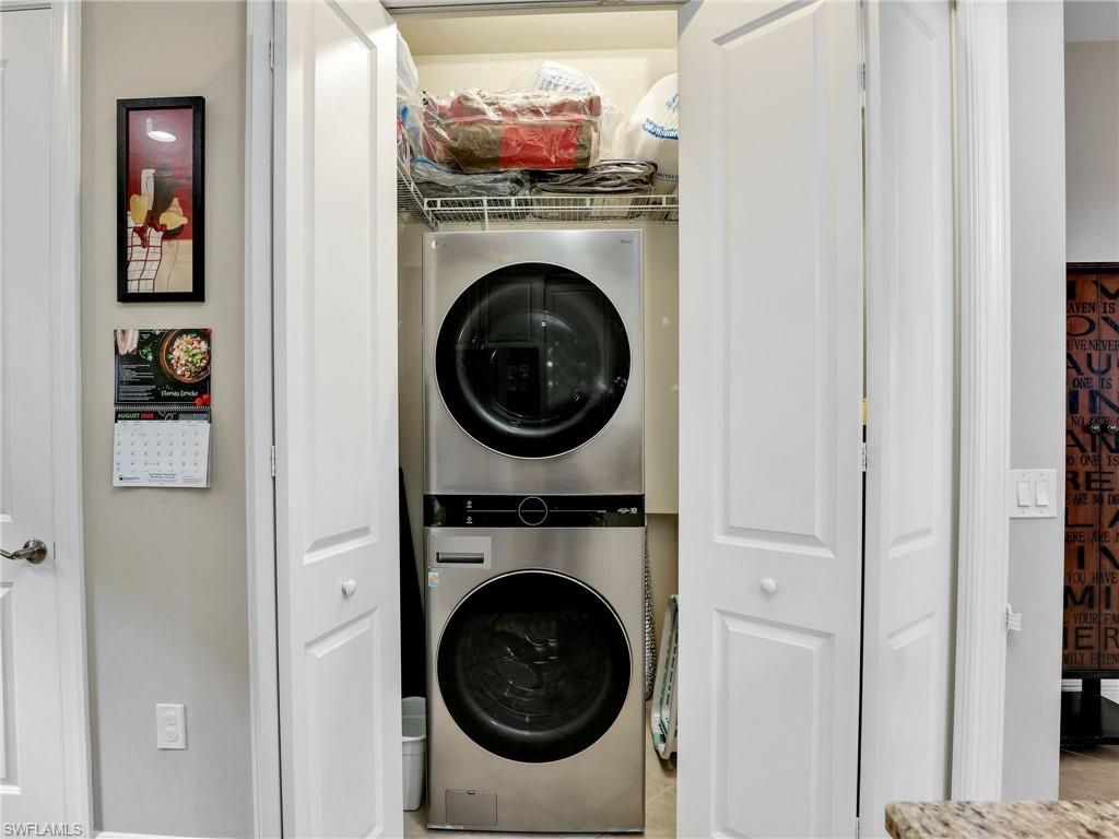 1242 Kendari Terrace Naples, FL 34113 - Photo 16 of 44 a utility room with dryer and washer