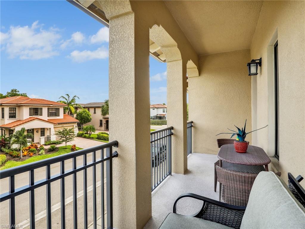 1242 Kendari Terrace Naples, FL 34113 - Photo 24 of 44 a balcony view with a fountain