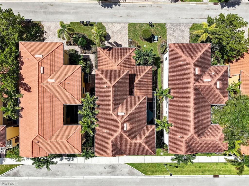 1242 Kendari Terrace Naples, FL 34113 - Photo 34 of 44 an aerial view of a house with yard and a garden