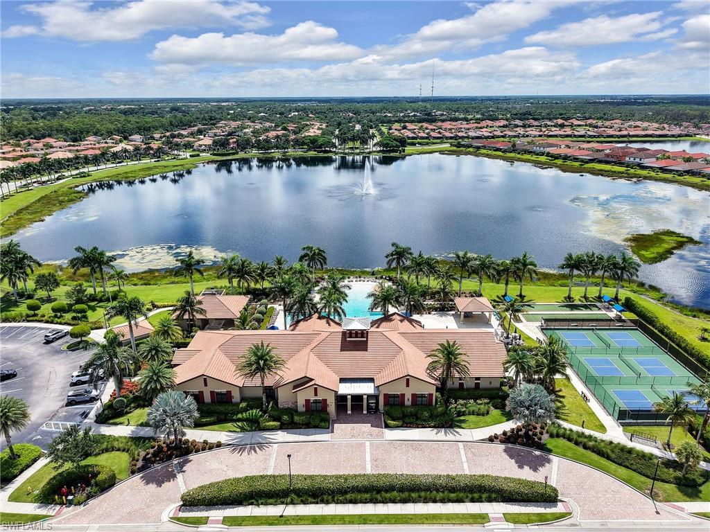 1242 Kendari Terrace Naples, FL 34113 - Photo 40 of 44 a view of a lake with houses