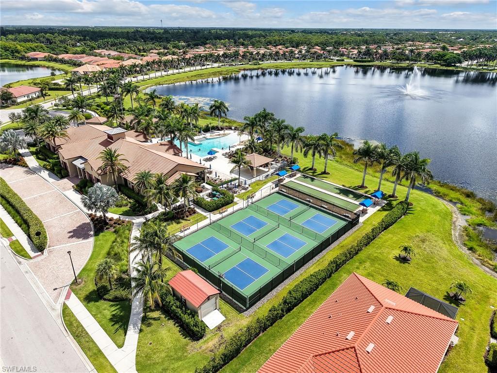 1242 Kendari Terrace Naples, FL 34113 - Photo 43 of 44 an aerial view of a house with a lake view