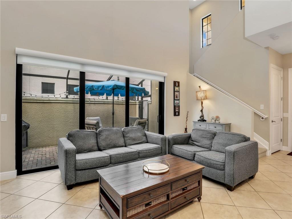 1242 Kendari Terrace Naples, FL 34113 - Photo 7 of 44 a living room with furniture and a window