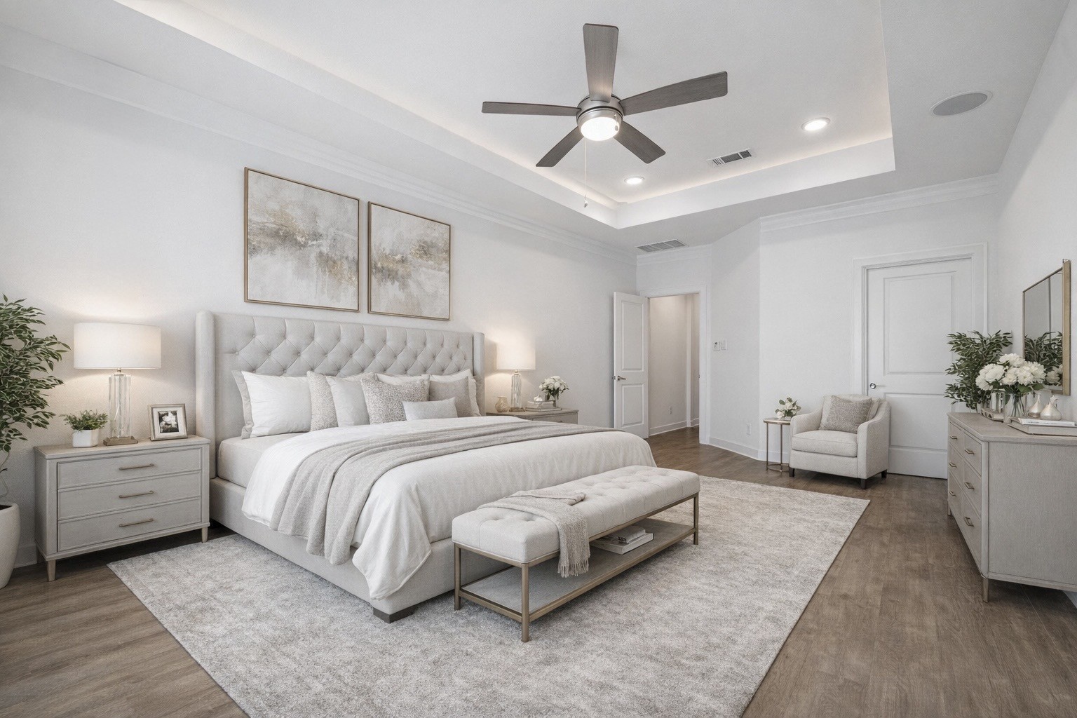 2714 Strathwood Lane Houston, TX 77082 - Photo 17 of 35 Virtually staged: The expansive primary bedroom offers a tranquil retreat with a tray ceiling, designer ceiling fan, warm wood flooring, built-in wireless speakers, and black-out window treatments for ultimate comfort.