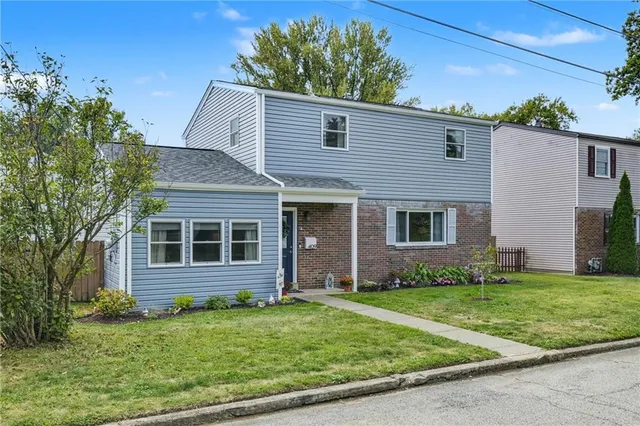 front view of a house with a yard