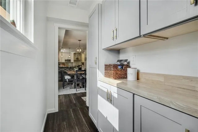 a kitchen with sink and cabinets