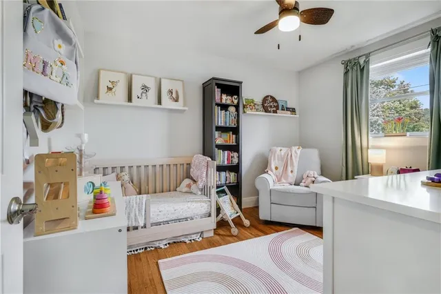 a bedroom with furniture and a window