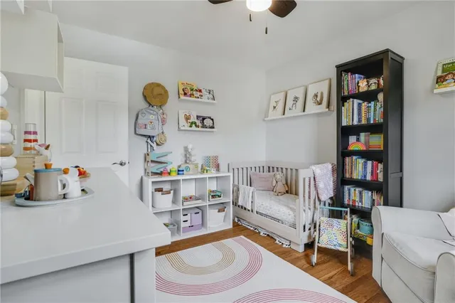 a living room with furniture and a book shelf