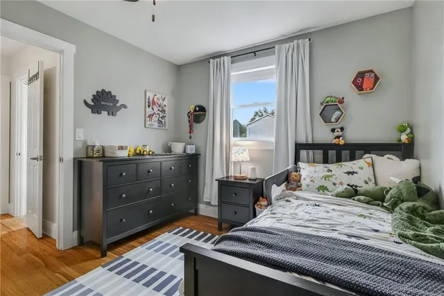 a bedroom with a bed and a dresser