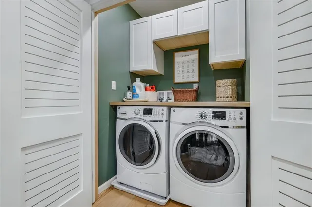 a view of a hallway with washer and dryer