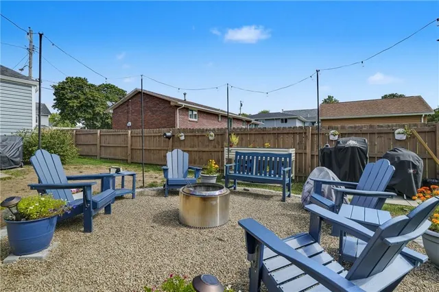 a view of a chairs and table in patio