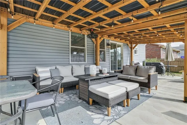 a building outdoor space with patio furniture and a potted plant