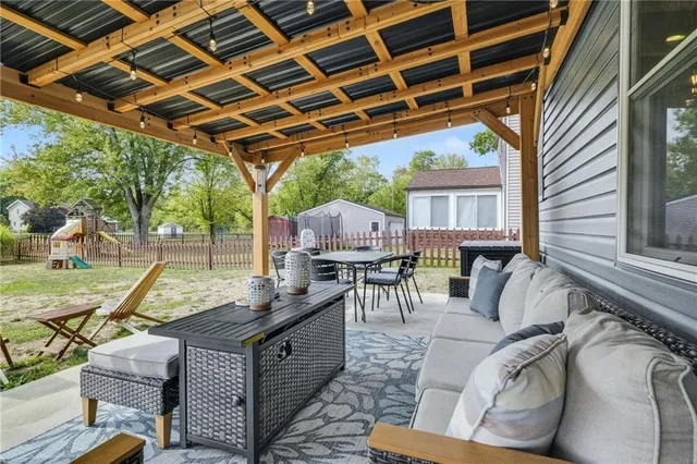 a view of a backyard with furniture