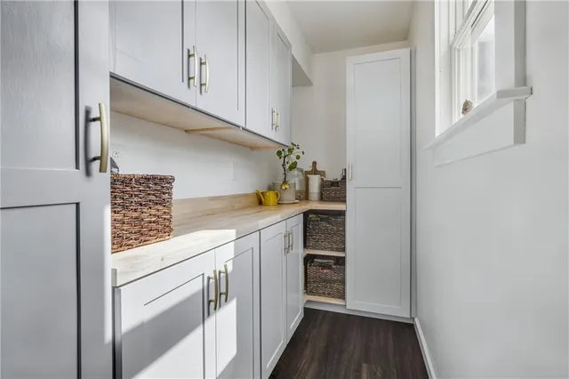 a kitchen with a cabinets and white appliances
