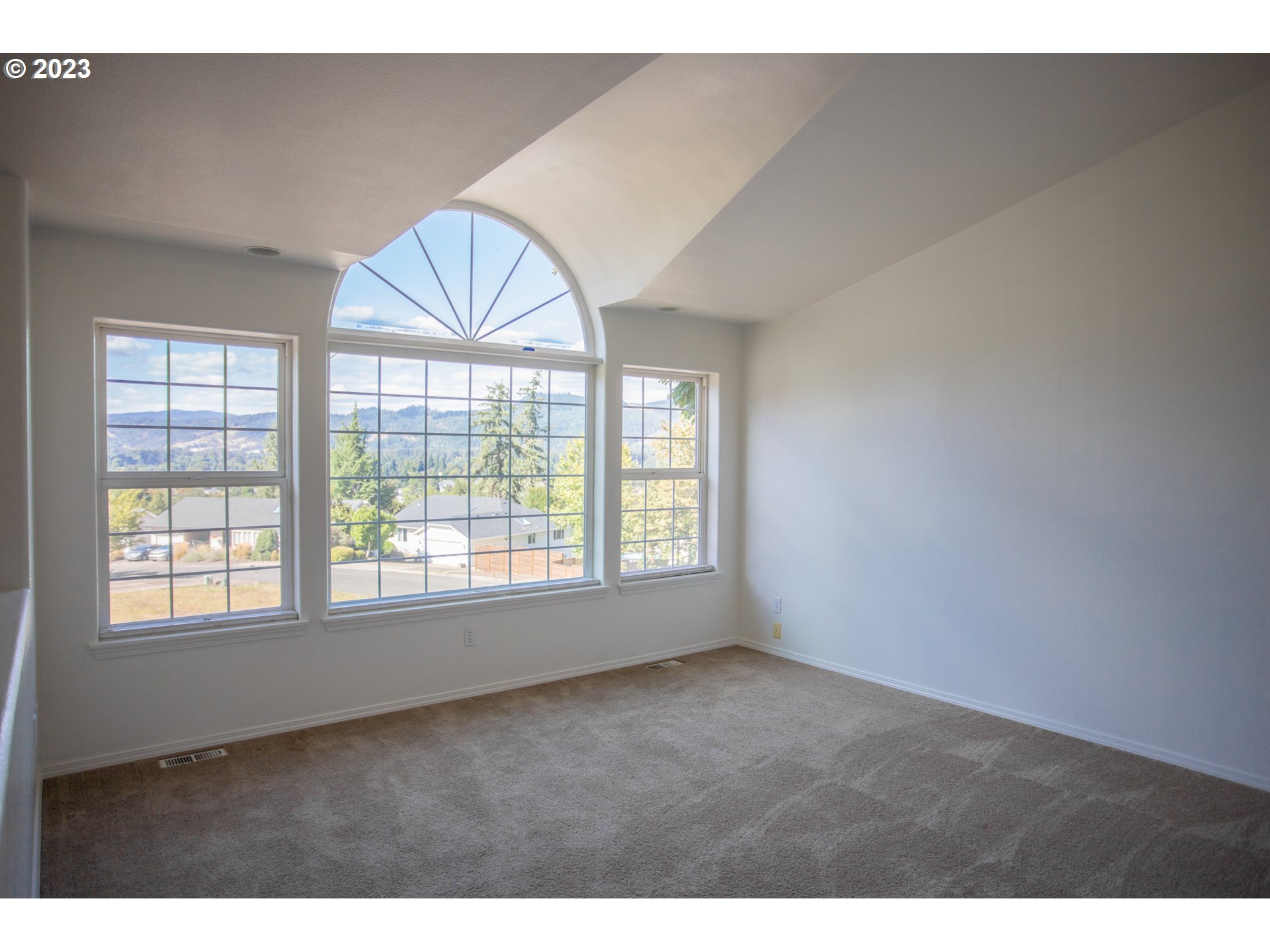 7305 Daisy Street Springfield, OR 97478 - Photo 4 of 23 a view of an empty room with a window