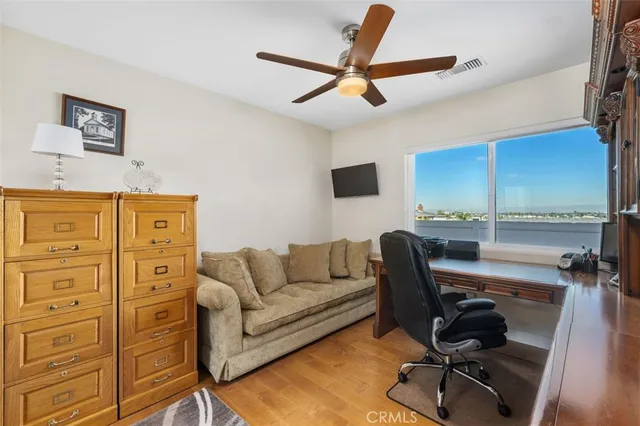 a work room with furniture and wooden floor