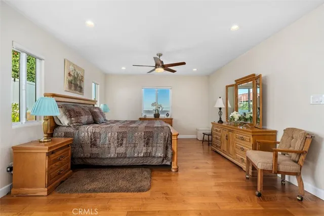 a bedroom with furniture and a window
