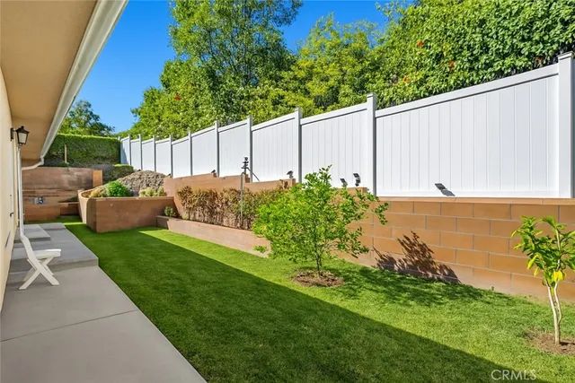 a backyard of a house with lots of green space