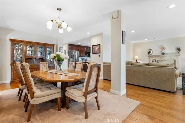 a view of a dining room with furniture and chandelier